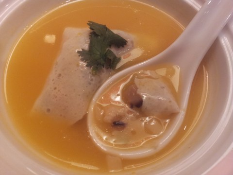 chicken & mushrooms in eggskin dumpling in pumpkin soup