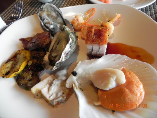 my plate of oysters.scallop, prawn salad