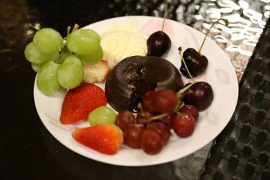 chocolate lava cakes with cherries, strawberries & grapes