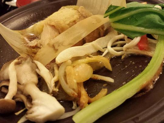 ham wrapped in leaves over hotpate