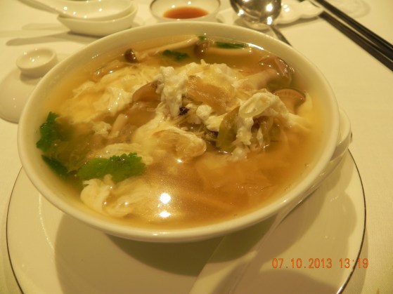 sliced fish century egg tan chai soup