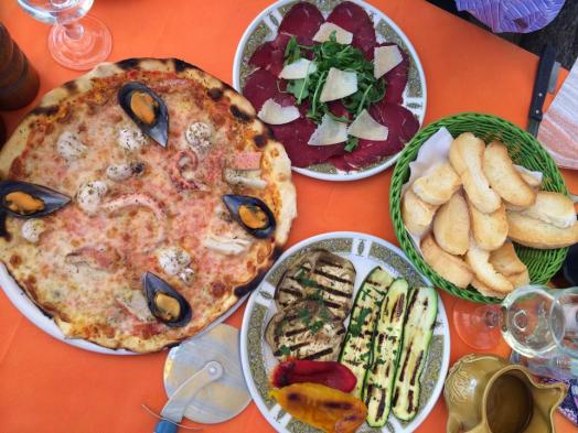 frutti di mare pizza, beef carpaccio, grilled eggplants, toast