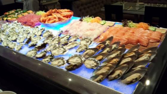 cold appetizers - oysters, mussels, scallops on shell, salmon, maguro & tai sashimi, prawns & some sushi