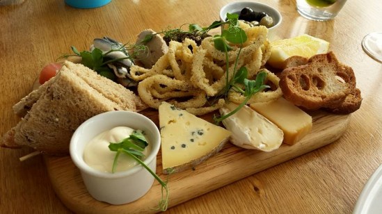 tasting board-aioli squid, chicken pate, cured herring, cheese platter, croutons, bread