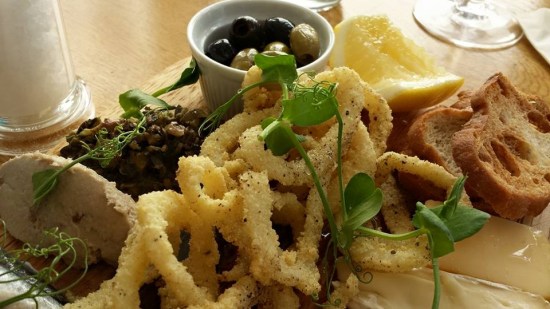 tasting board-aioli squid, chicken pate, cured herring, cheese platter, croutons, bread