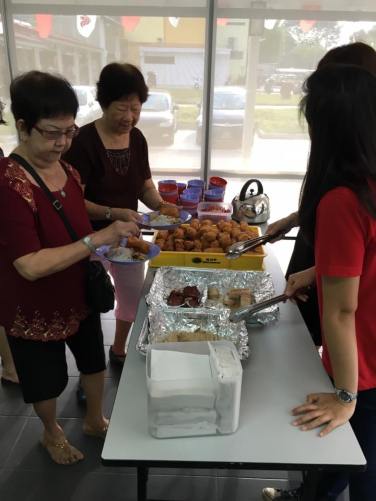 centre staff serving the residents