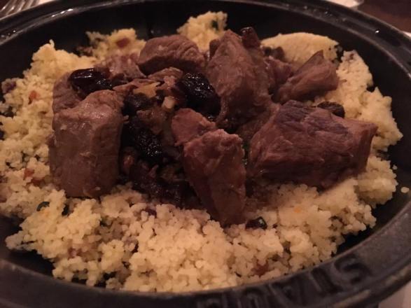 black pig with cous cous