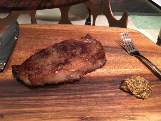 pan charred grain fed black angus ribeye