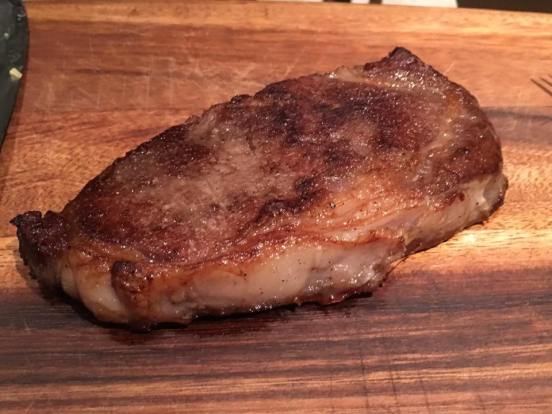 pan charred grain fed black angus ribeye