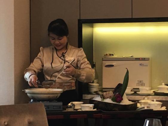 server poaching tiger garoupa in lobster broth