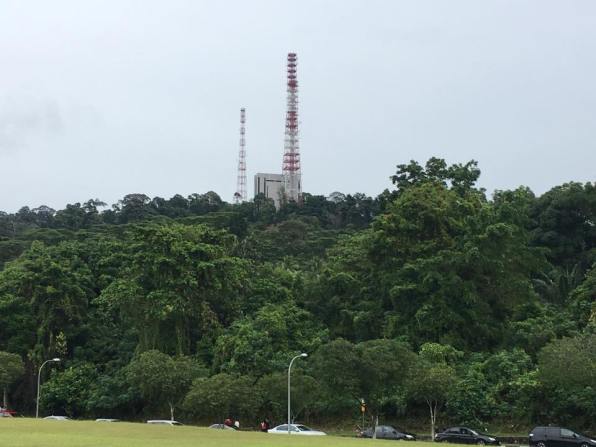 view of tower from overhead bridge crossing over to the courts side