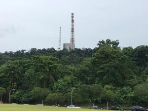 view of tower from overhead bridge crossing over to the courts side