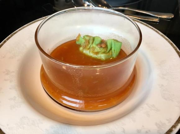 clear tomato soup with dumpling