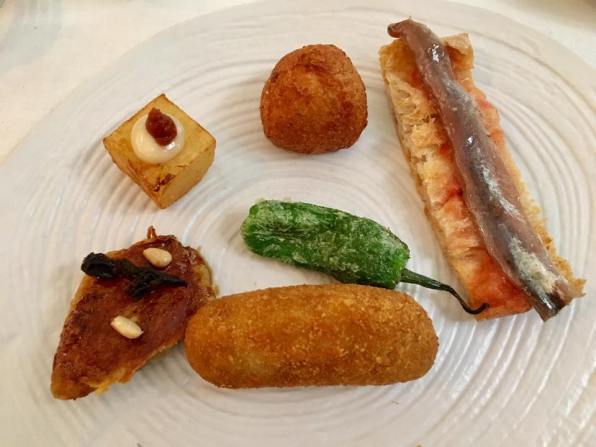 tapas - anchovy bruschetta, croquette, a marinated panfried mackarel etc