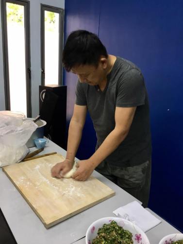 one resident demonstrates making dumpling 饺子