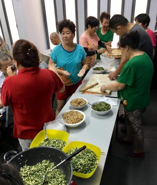 others trying their hands in making dumplings
