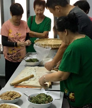 others trying their hands in making dumplings