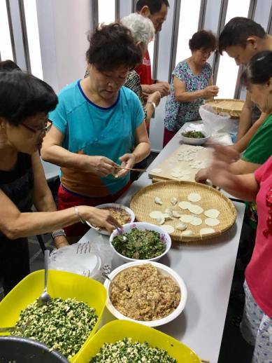 others trying their hands in making dumplings
