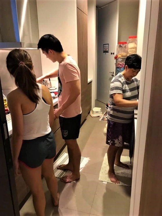 son making crabmeat pasta